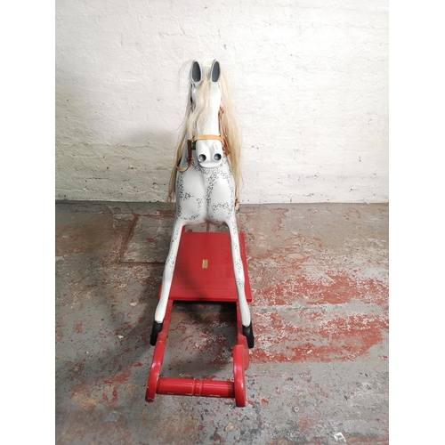 394 - A modern hand painted wooden rocking horse - approx. 112cm high x 43cm wide x 178cm long