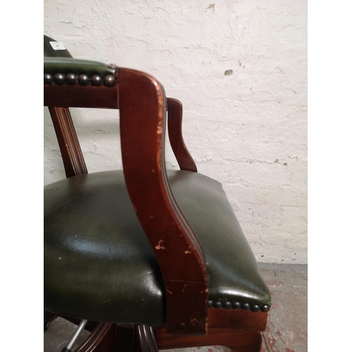 397 - A green leather and mahogany swivel captain's desk chair - approx. 80cm high x 58cm wide x 46cm deep