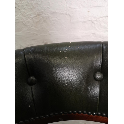 397 - A green leather and mahogany swivel captain's desk chair - approx. 80cm high x 58cm wide x 46cm deep