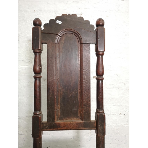 398 - A Georgian oak hall chair - approx. 116cm high x 45cm wide x 39cm deep