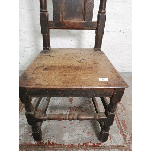 398 - A Georgian oak hall chair - approx. 116cm high x 45cm wide x 39cm deep