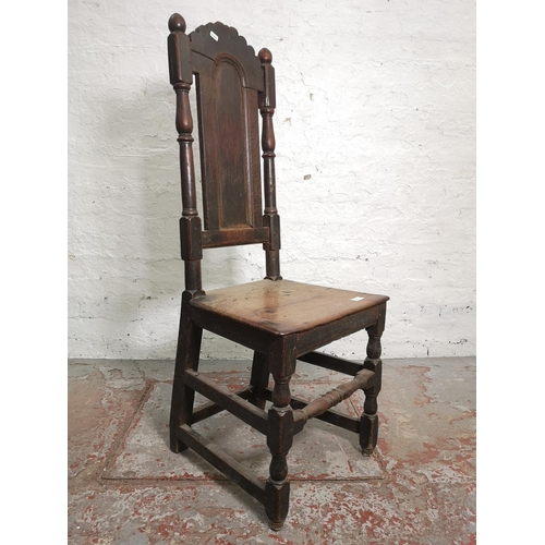 398 - A Georgian oak hall chair - approx. 116cm high x 45cm wide x 39cm deep