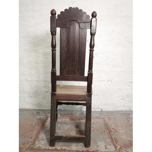 398 - A Georgian oak hall chair - approx. 116cm high x 45cm wide x 39cm deep