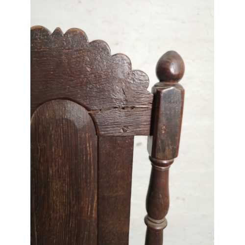 398 - A Georgian oak hall chair - approx. 116cm high x 45cm wide x 39cm deep