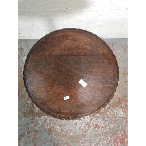 400 - A 19th century oak pie crust edge circular tripod side table - approx. 69.5cm high x 46cm diameter