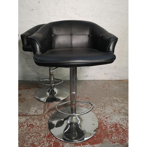 412 - A set of four black leatherette and chrome effect kitchen bar stools