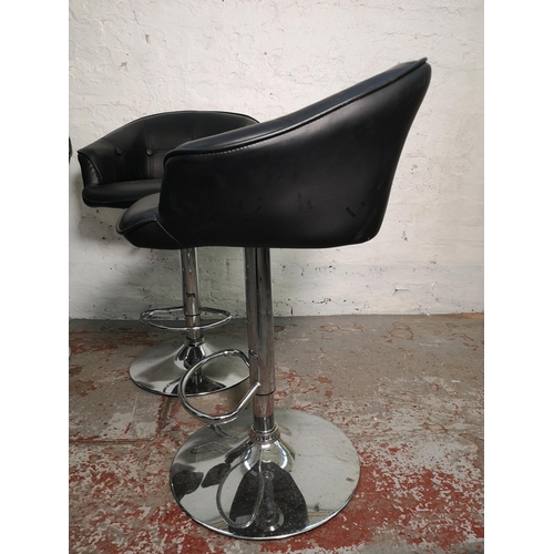 412 - A set of four black leatherette and chrome effect kitchen bar stools