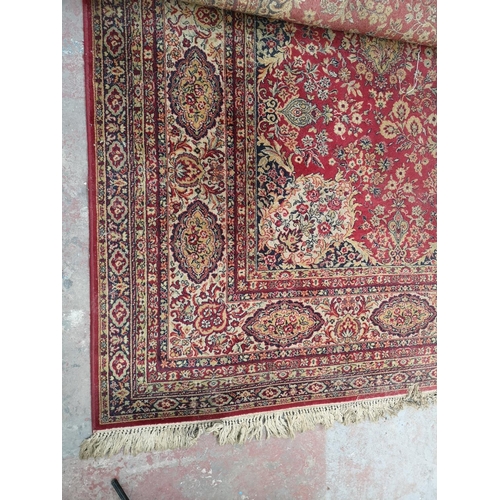 413 - A large Persian style rug