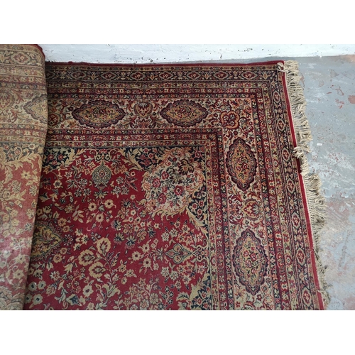 413 - A large Persian style rug