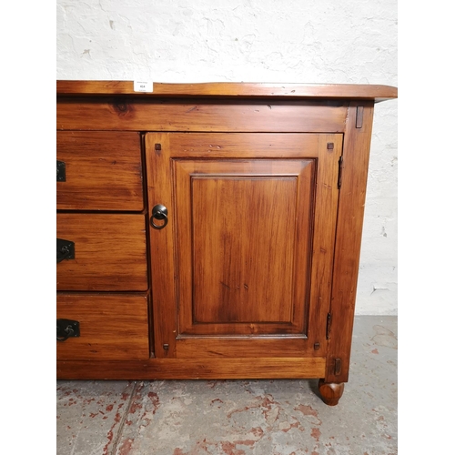 414 - A modern hardwood sideboard with two outer cupboard doors and three central drawers - approx. 81cm h... 