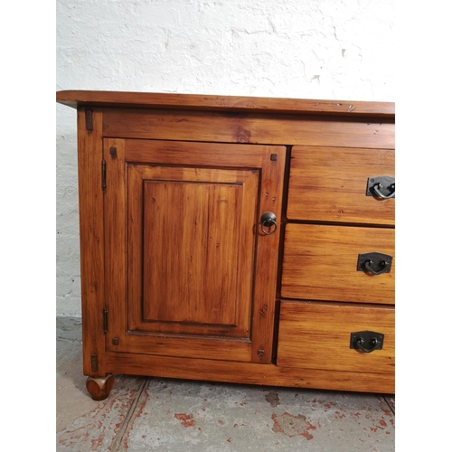 414 - A modern hardwood sideboard with two outer cupboard doors and three central drawers - approx. 81cm h... 