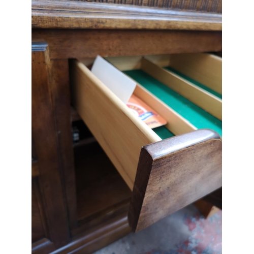 418 - A late 20th century oak display cabinet with two upper glazed doors and two lower cupboard doors - a... 