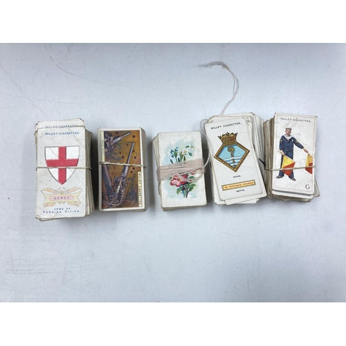 202 - A large collection of assorted antique and vintage cigarette cards to include Gallaher Ltd, Ogden's,... 