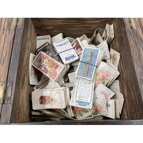 202 - A large collection of assorted antique and vintage cigarette cards to include Gallaher Ltd, Ogden's,... 