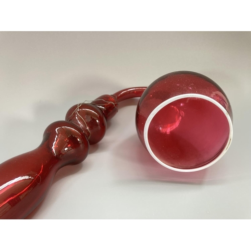 209 - A 19th century Nailsea style cranberry glass pipe - approx. 69cm long