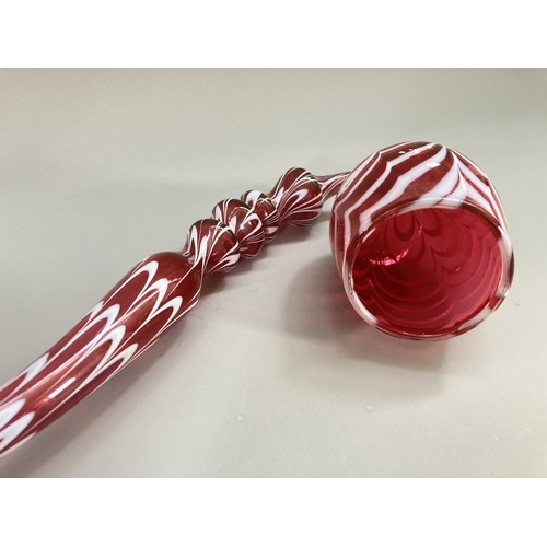 213 - A 19th century Nailsea style cranberry and white swirl glass pipe - approx. 40cm long