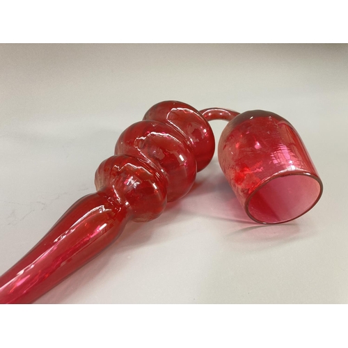 216 - A 19th century Nailsea style cranberry glass pipe - approx. 39cm long