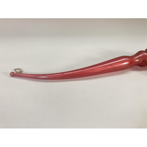 219 - A 19th century Nailsea style cranberry glass pipe - approx. 44cm long