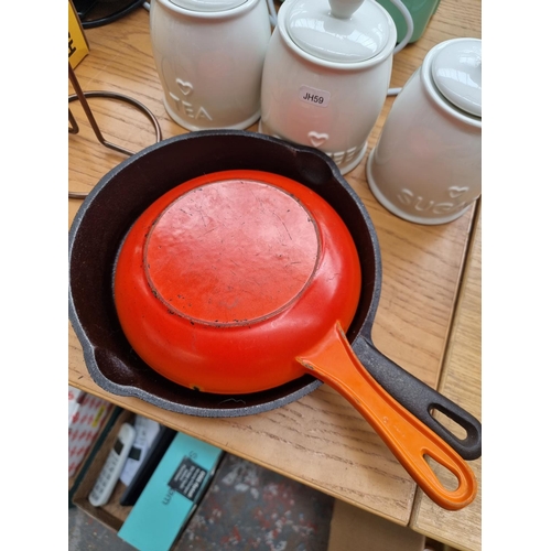 783 - A collection of kitchen items, one Le Creuset frying pan, one cast iron frying pan, Country Heart te... 