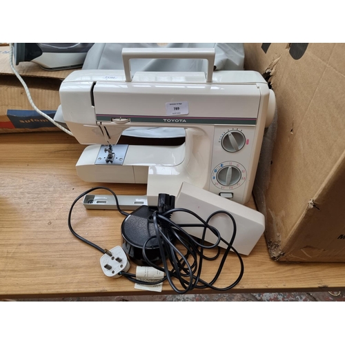 789 - A Toyota 4081 electric sewing machine with foot pedal and cover