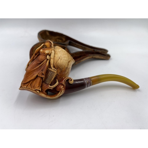 1367 - Two antique carved Meerschaum smoking pipes with leather cases