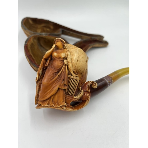 1367 - Two antique carved Meerschaum smoking pipes with leather cases