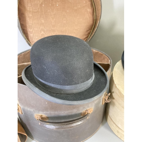 245 - Three vintage hats to include Christy's London bowler, Dunn & Co etc. and two vintage hat boxes, one... 