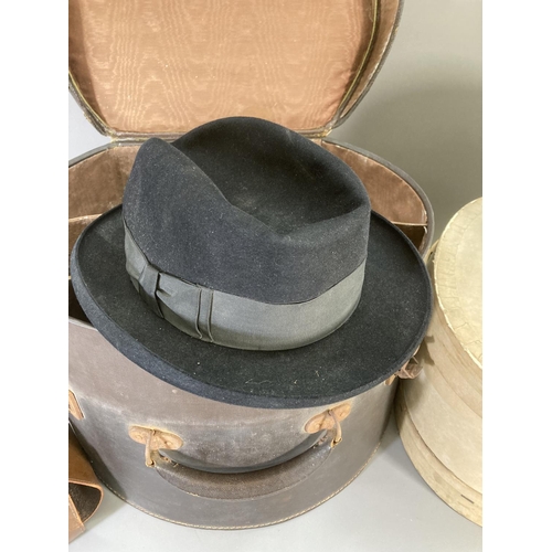 245 - Three vintage hats to include Christy's London bowler, Dunn & Co etc. and two vintage hat boxes, one... 