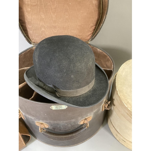 245 - Three vintage hats to include Christy's London bowler, Dunn & Co etc. and two vintage hat boxes, one... 