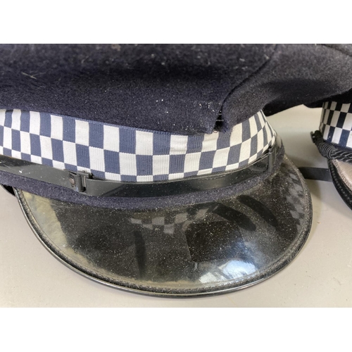 246 - A collection of mid/late 20th century police memorabilia to include four Merseyside Police hats, two... 