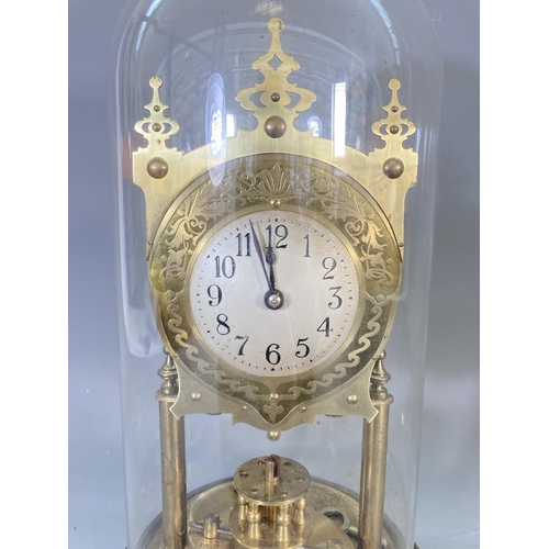 255 - A BHA brass anniversary clock with glass dome and key - approx. 33cm high