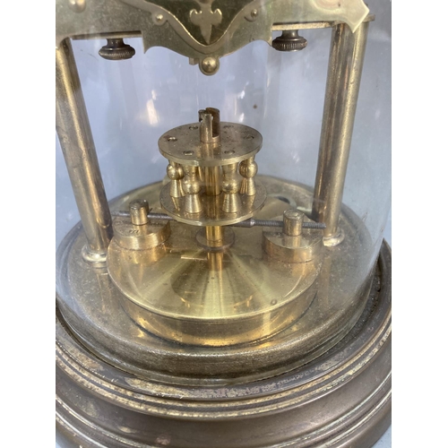 255 - A BHA brass anniversary clock with glass dome and key - approx. 33cm high