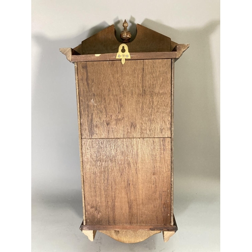 261 - A late 20th century mahogany cased wall clock with pendulum and key - approx. 71cm high x 33cm wide ... 