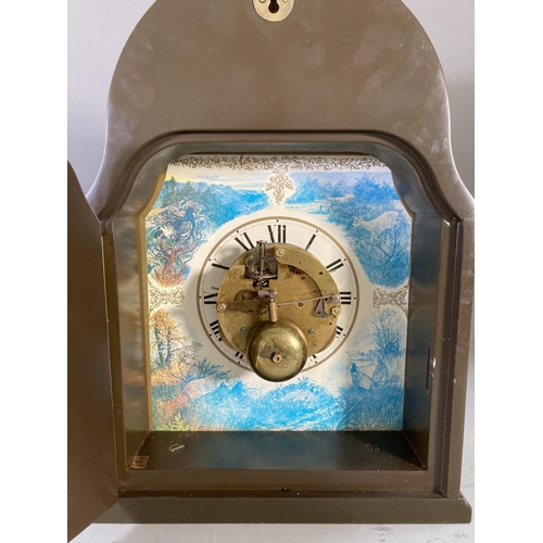 264 - A late 20th century burr walnut effect cased mantel clock - approx. 37cm high x 25cm wide x 10cm dee... 