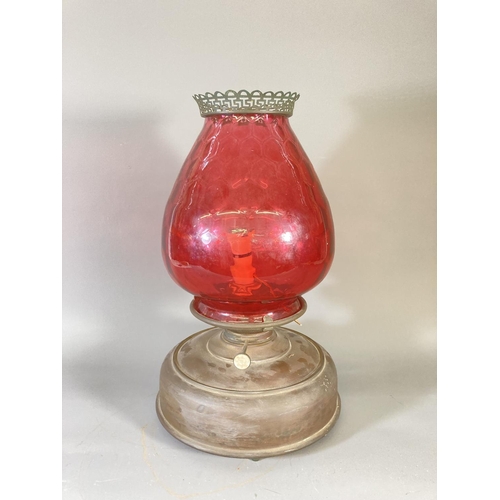 132 - Two antique brass electric converted oil lamps with cranberry glass shades - largest approx. 28cm hi... 