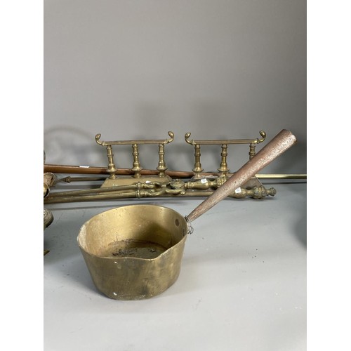 133 - A collection of copper and brassware to include lantern, companion set, saucepan, candlesticks etc.