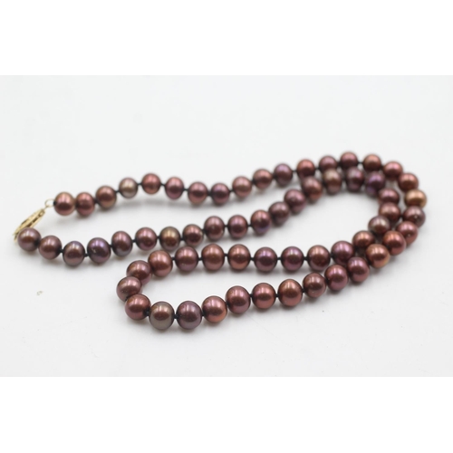 1072 - A 14ct gold clasped pearl single strand necklace - approx. gross weight 28.7 grams