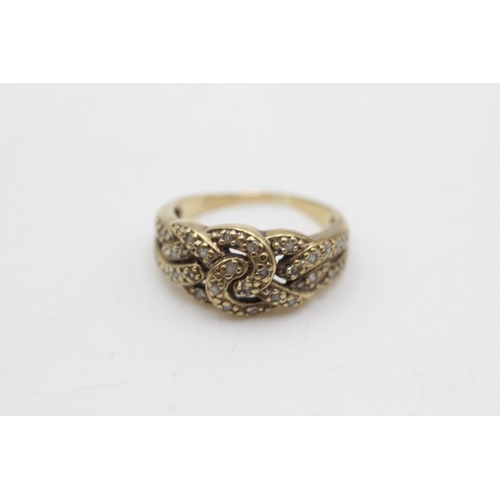 1073 - A 9ct gold diamond knot ring, size N½ - approx. gross weight 3.6 grams