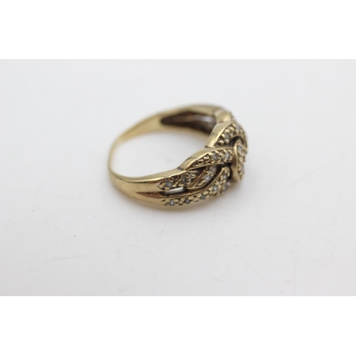 1073 - A 9ct gold diamond knot ring, size N½ - approx. gross weight 3.6 grams