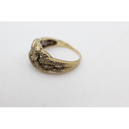 1073 - A 9ct gold diamond knot ring, size N½ - approx. gross weight 3.6 grams