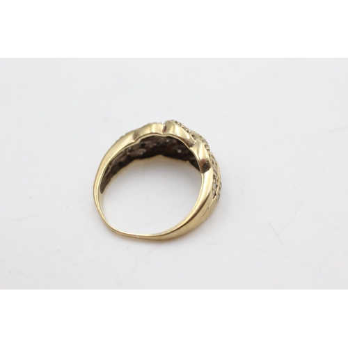 1073 - A 9ct gold diamond knot ring, size N½ - approx. gross weight 3.6 grams