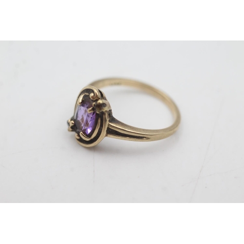 1079 - A 10ct gold synthetic pink sapphire and brown gemstone ring, size M - approx. gross weight 2.8 grams