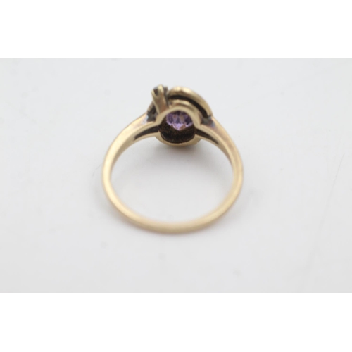 1079 - A 10ct gold synthetic pink sapphire and brown gemstone ring, size M - approx. gross weight 2.8 grams