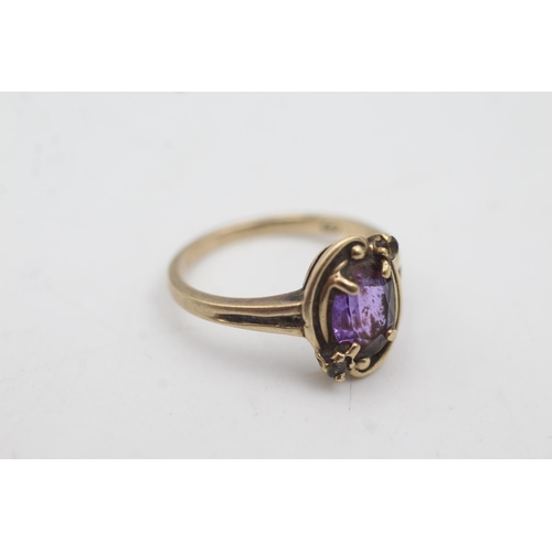 1079 - A 10ct gold synthetic pink sapphire and brown gemstone ring, size M - approx. gross weight 2.8 grams