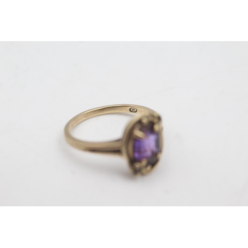 1079 - A 10ct gold synthetic pink sapphire and brown gemstone ring, size M - approx. gross weight 2.8 grams