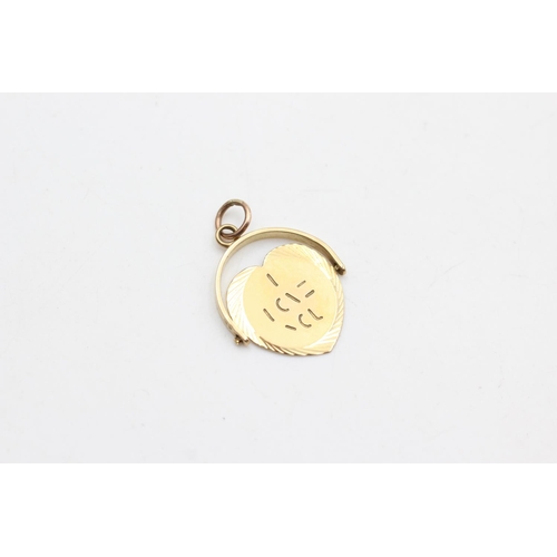 1085 - A 9ct gold 'I love you' spinner pendant - approx. gross weight 2 grams