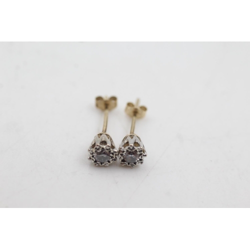 1086 - A pair of 9ct gold vintage diamond stud earrings - approx. gross weight 1 gram