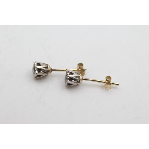 1086 - A pair of 9ct gold vintage diamond stud earrings - approx. gross weight 1 gram