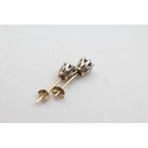 1086 - A pair of 9ct gold vintage diamond stud earrings - approx. gross weight 1 gram