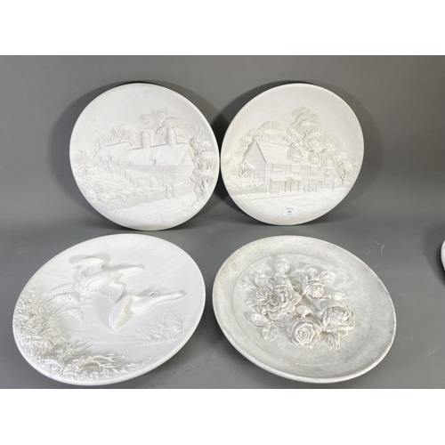 183 - Six pieces of Bossons unpainted chalk ware, four chargers, one oval floral frame and one plaque